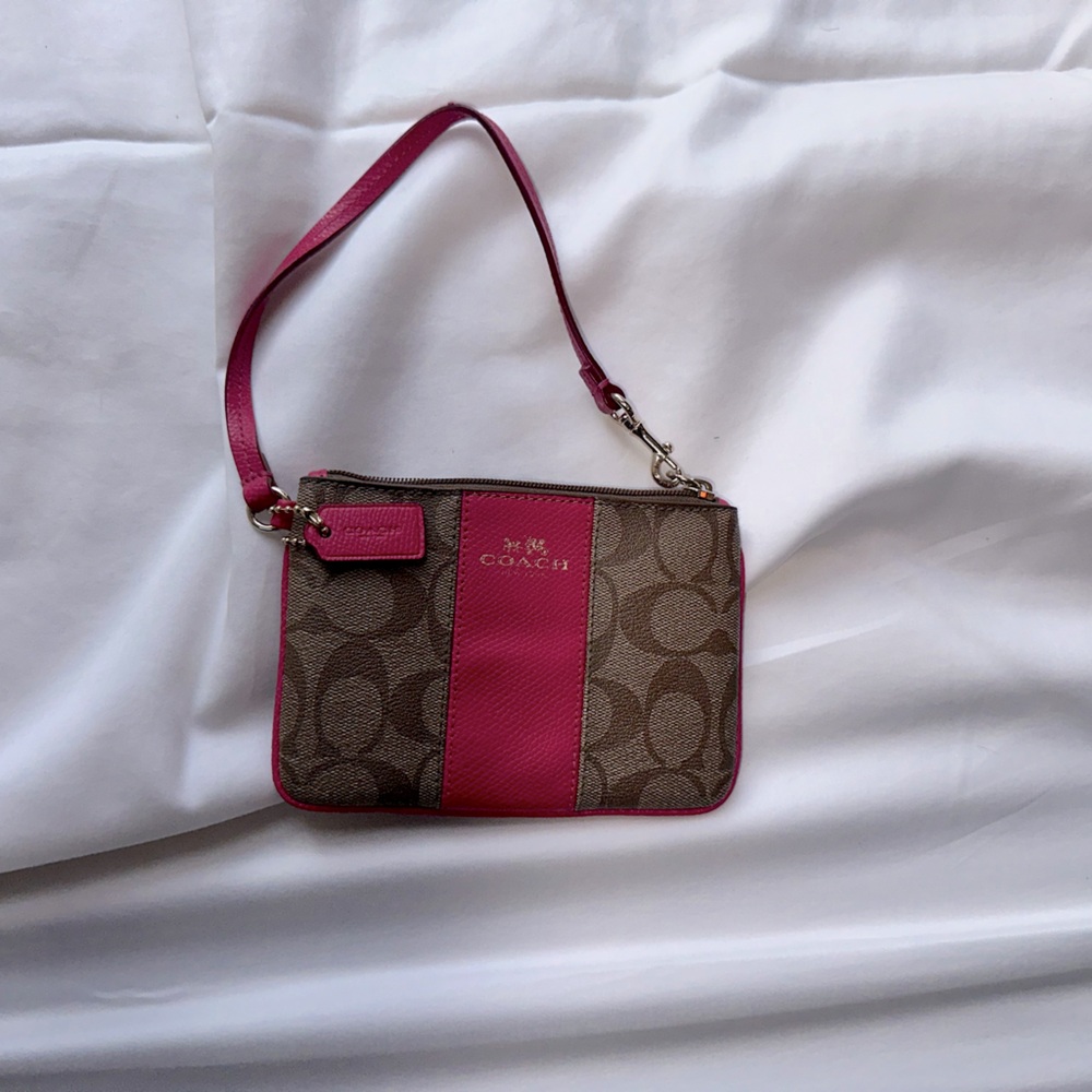 Coach wristlet with pink lining